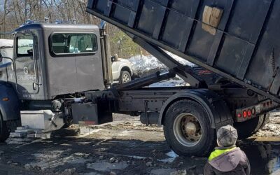 The boss is out supervising snow hauling
