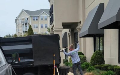 Spreading some mulch to spruce up a retail customer’s building. Curb appeal is key!